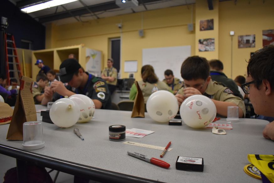 Boy scouts learning detective work. 