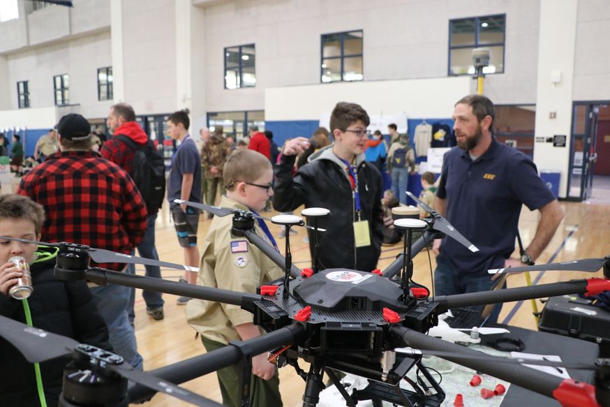 Boy scouts learning about drones.