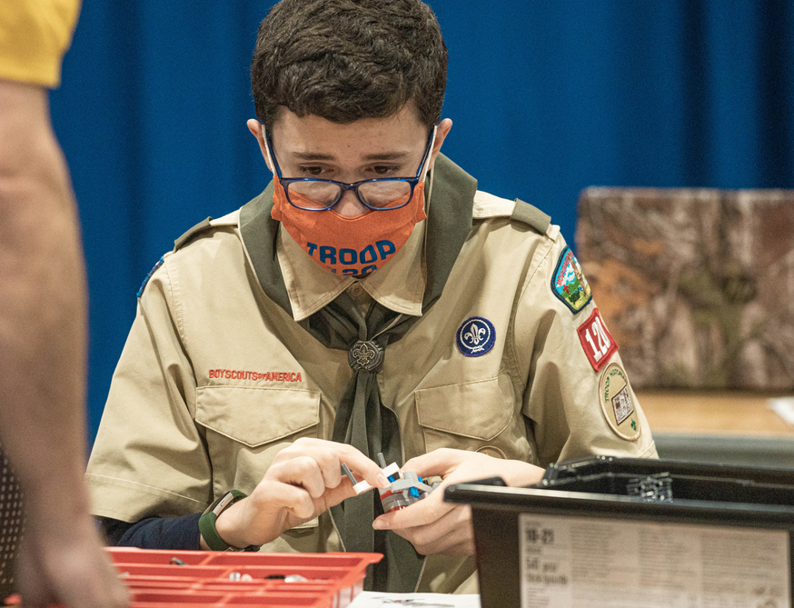 picture of scout building a robot during merit badge class 