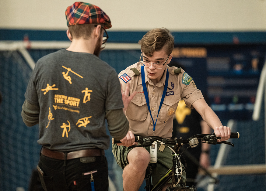 photo of a scout riding a stationary bike 