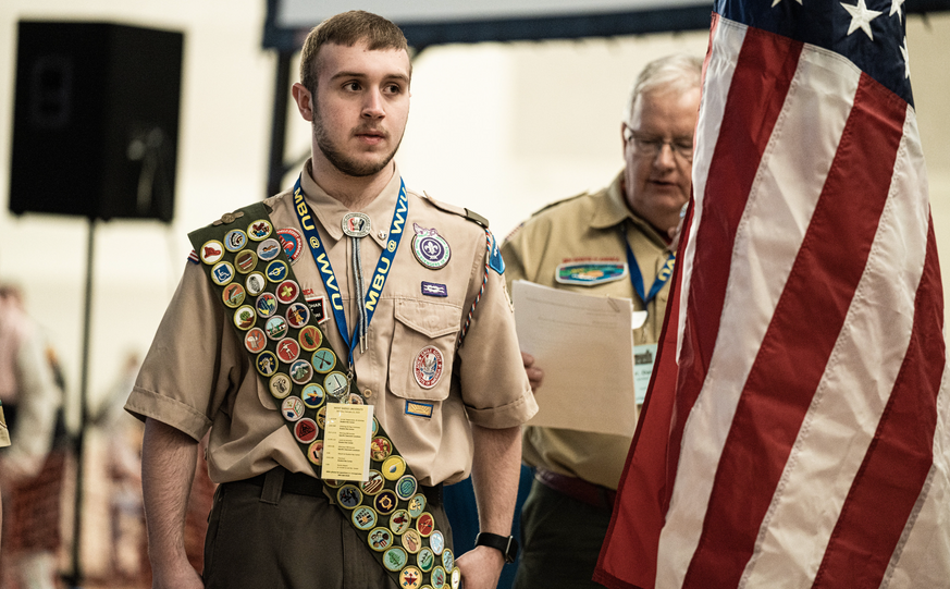 Photo of scout being recognized for merit badge accomplishments  