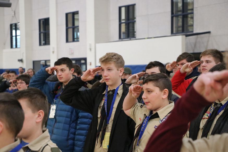 Boy scouts saluting.